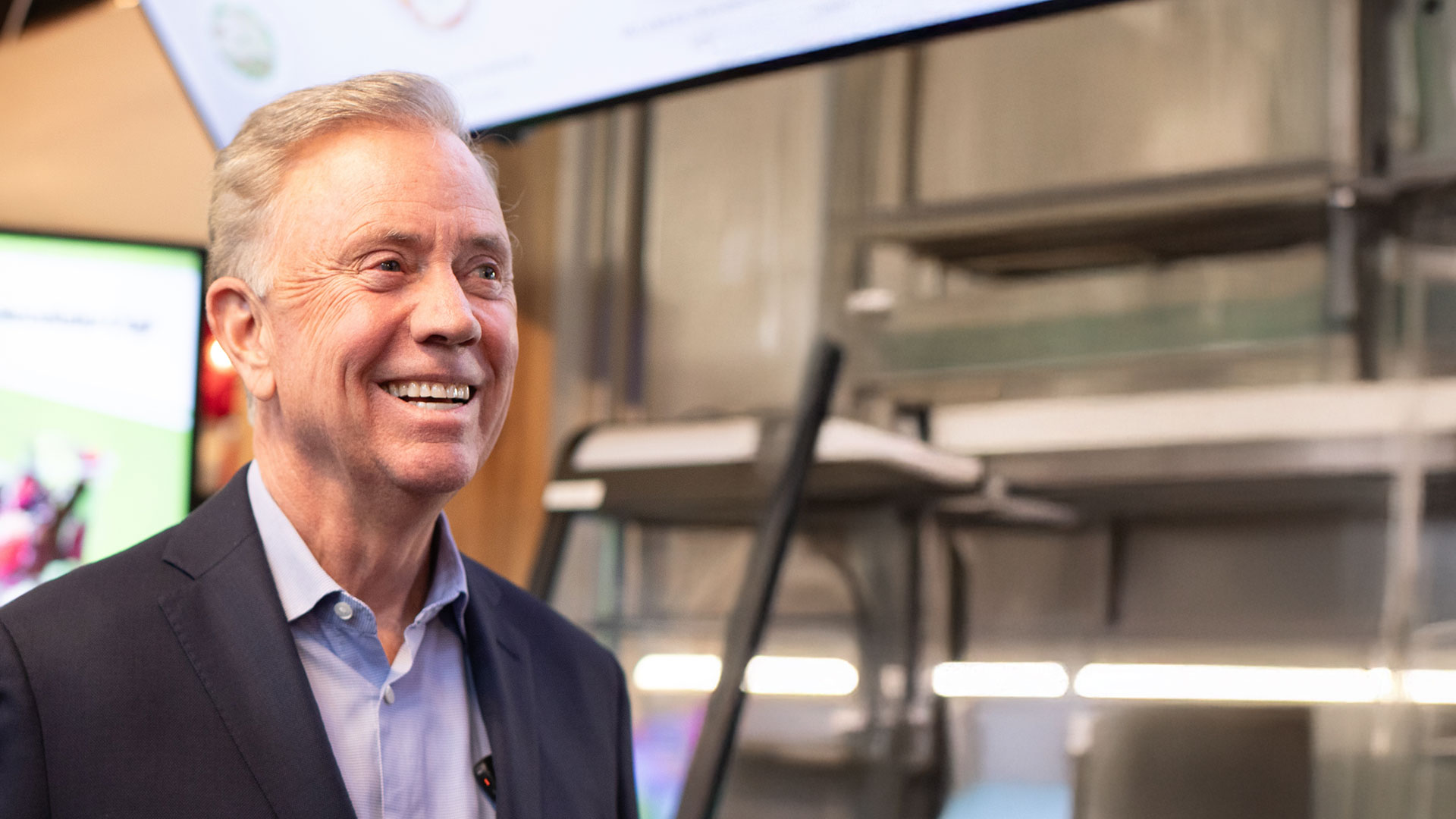 Ned Lamont smiling and looking to the side